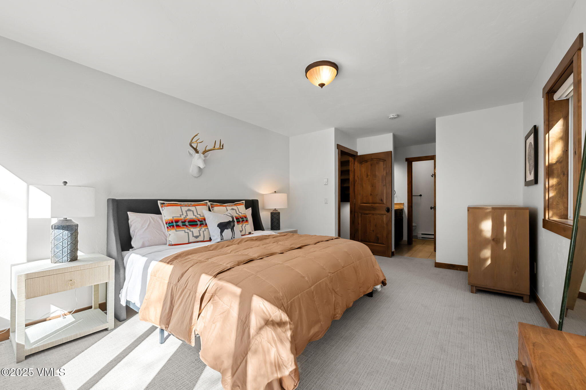 4770 Big Horn Road, Unit B4 Vail, CO 81657 - Photo 14 of 47 a bedroom with a bed and a refrigerator