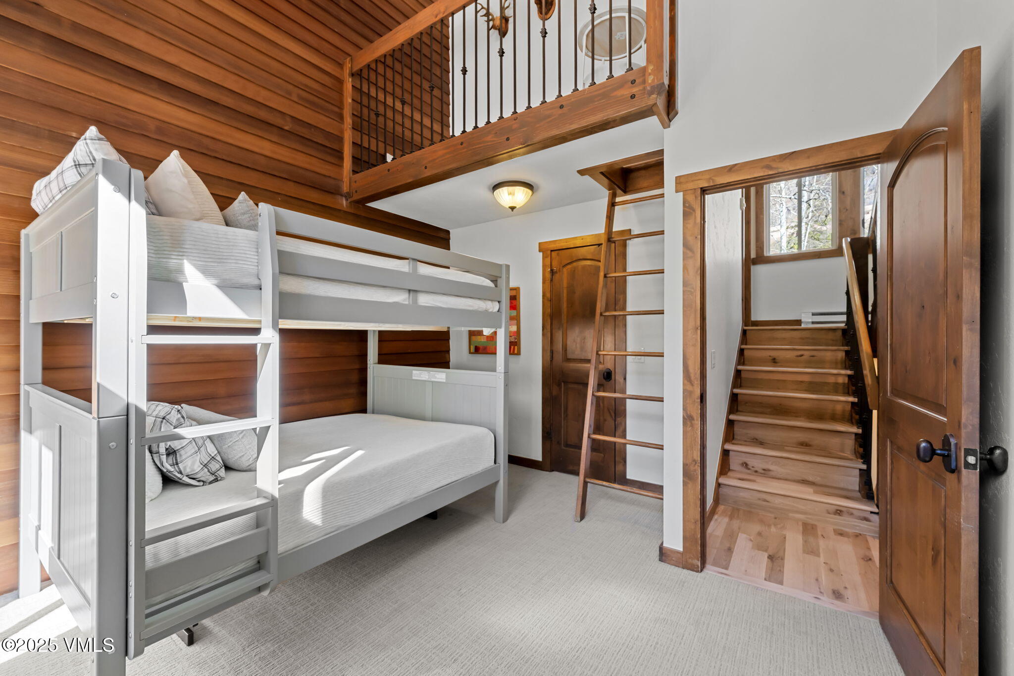 4770 Big Horn Road, Unit B4 Vail, CO 81657 - Photo 18 of 47 a bedroom with furniture and a staircase