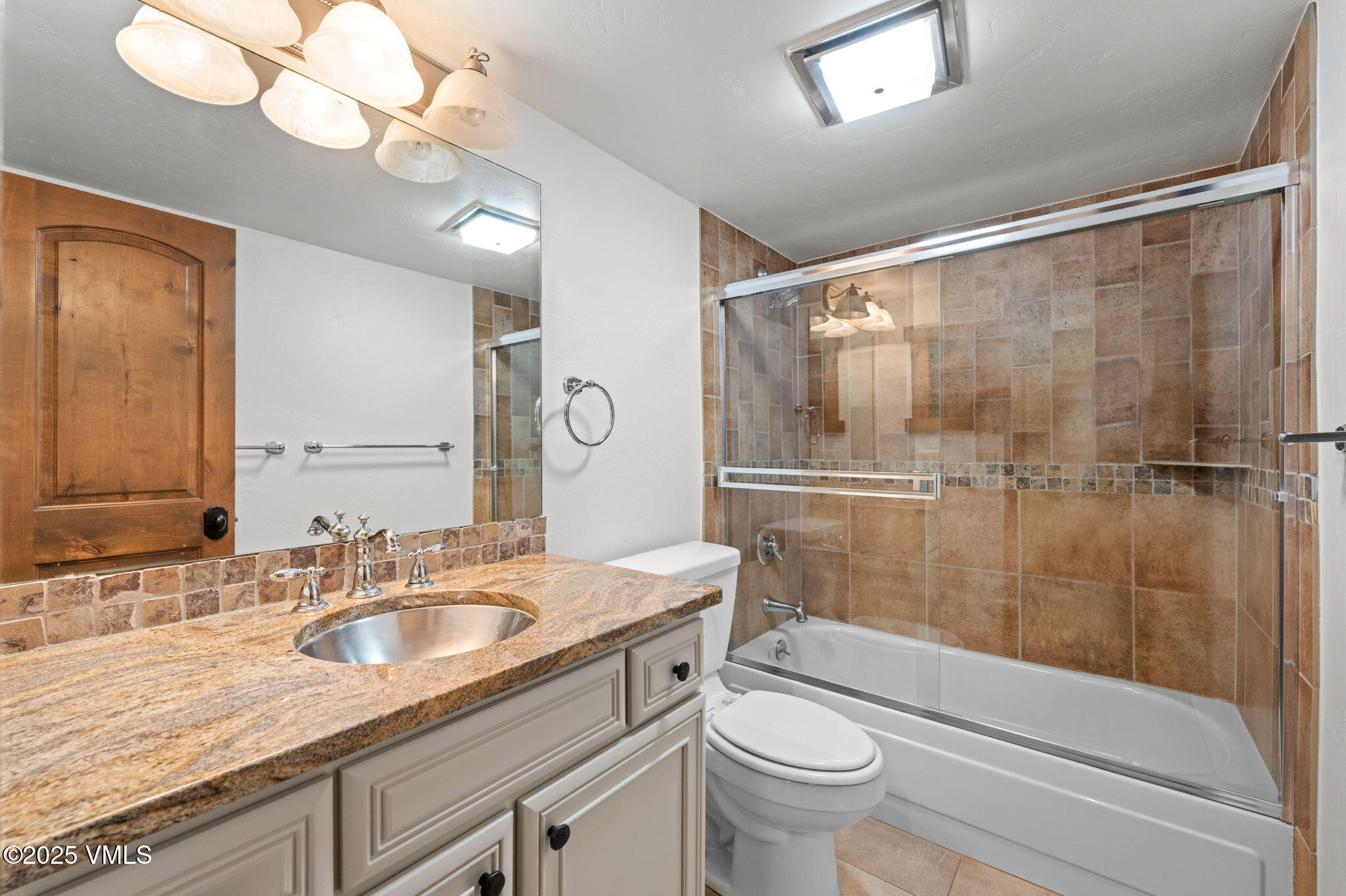 4770 Big Horn Road, Unit B4 Vail, CO 81657 - Photo 19 of 47 a bathroom with a sink a toilet a mirror and shower
