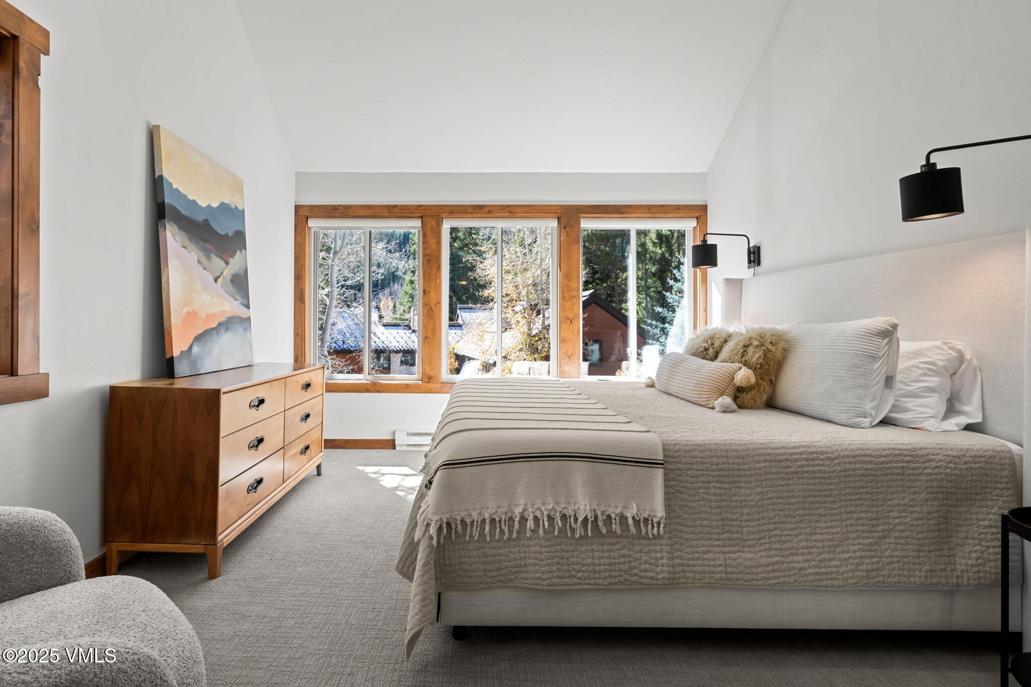 4770 Big Horn Road, Unit B4 Vail, CO 81657 - Photo 21 of 47 a spacious bedroom with a bed and a large window