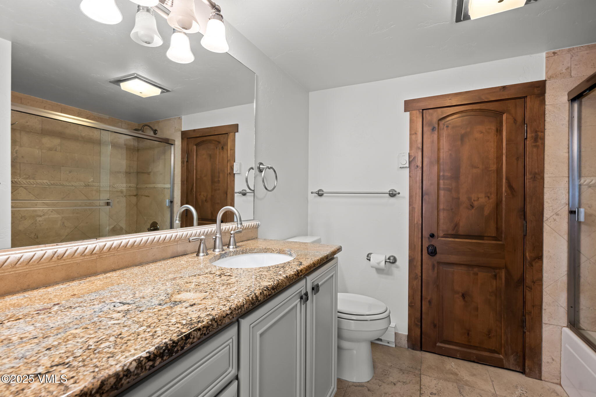 4770 Big Horn Road, Unit B4 Vail, CO 81657 - Photo 24 of 47 a bathroom with a granite countertop sink a toilet and shower