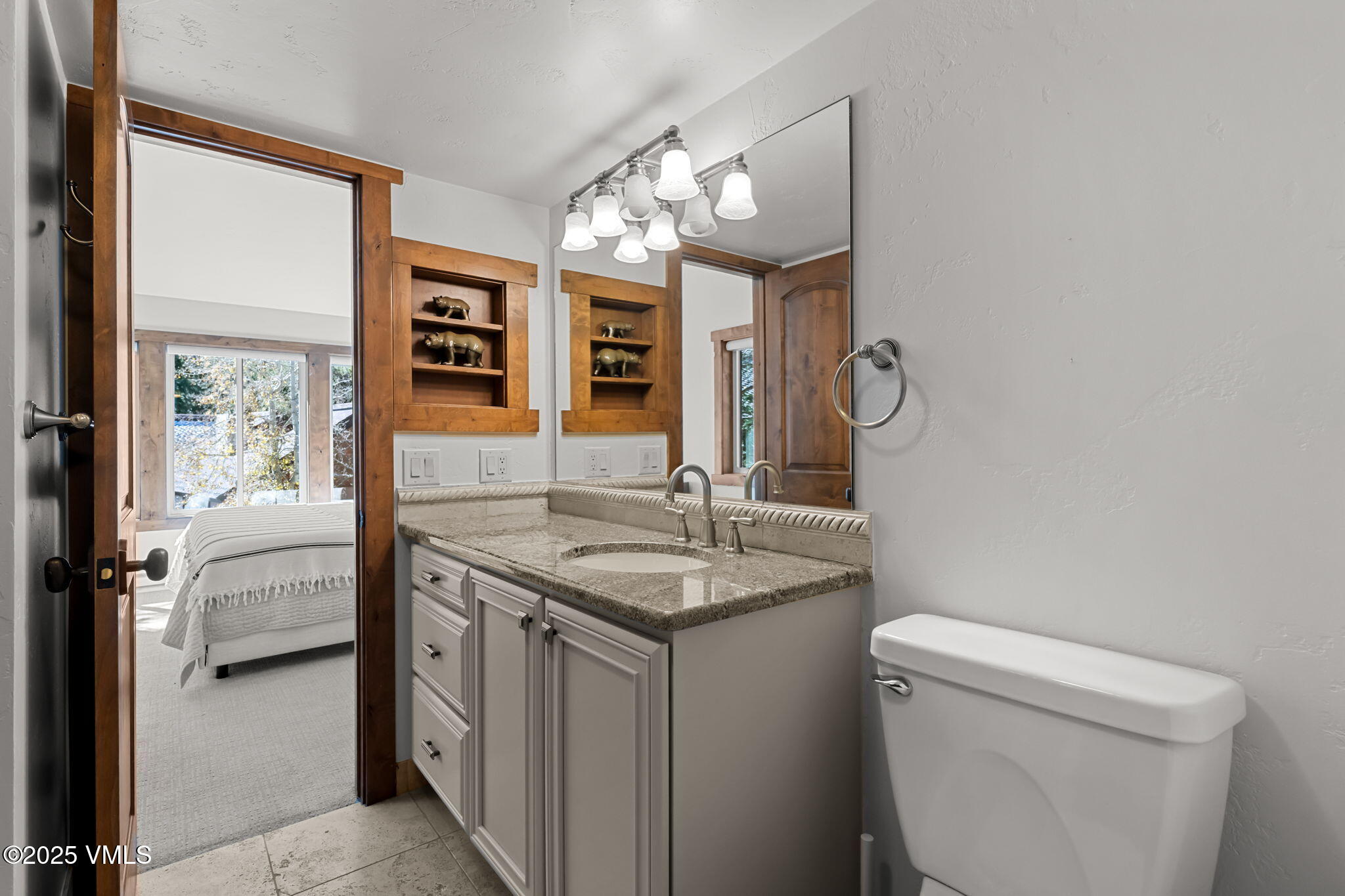 4770 Big Horn Road, Unit B4 Vail, CO 81657 - Photo 25 of 47 a bathroom with a granite countertop sink a toilet and a mirror