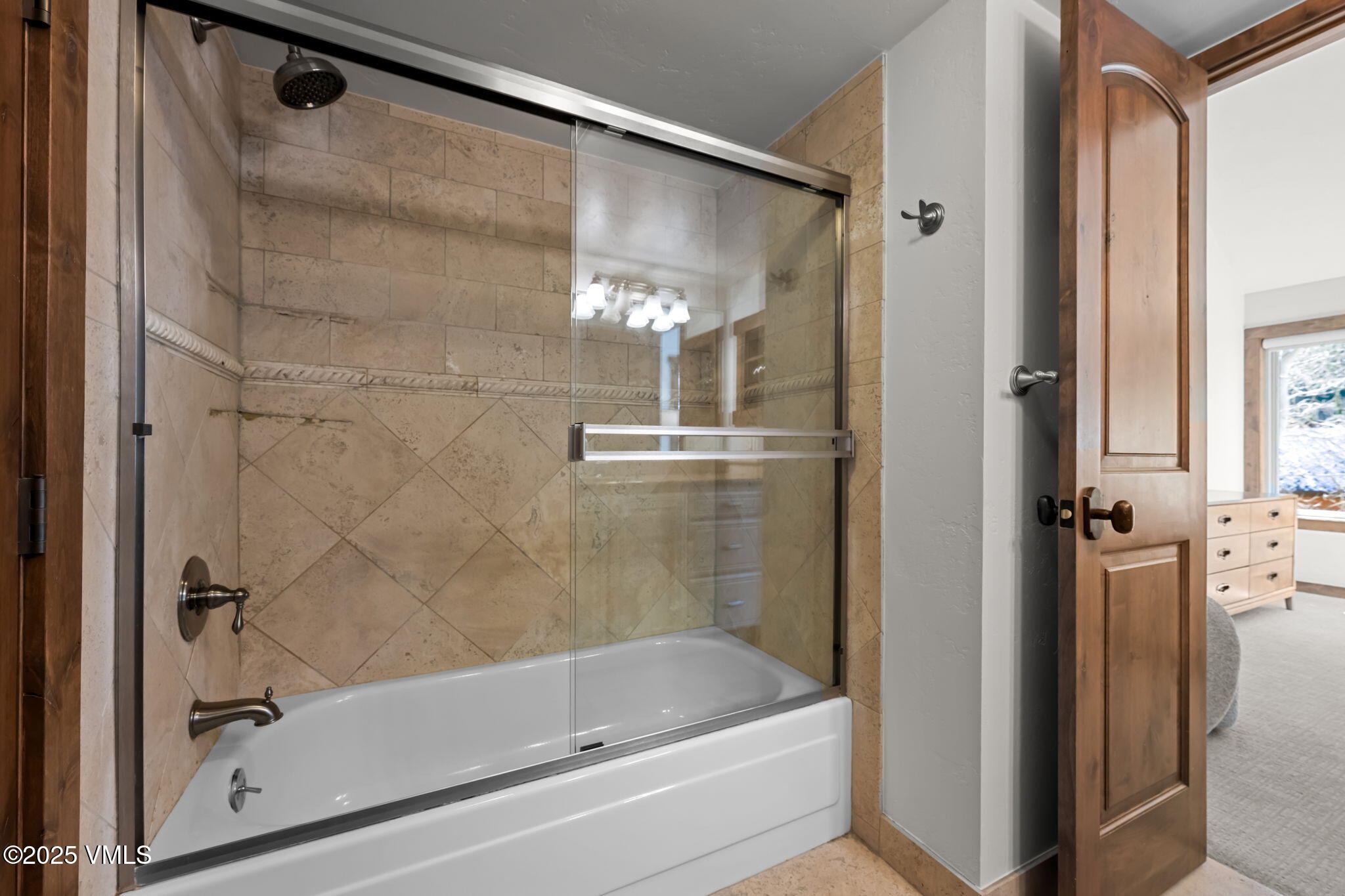 4770 Big Horn Road, Unit B4 Vail, CO 81657 - Photo 26 of 47 a bathroom with a bathtub and a shower