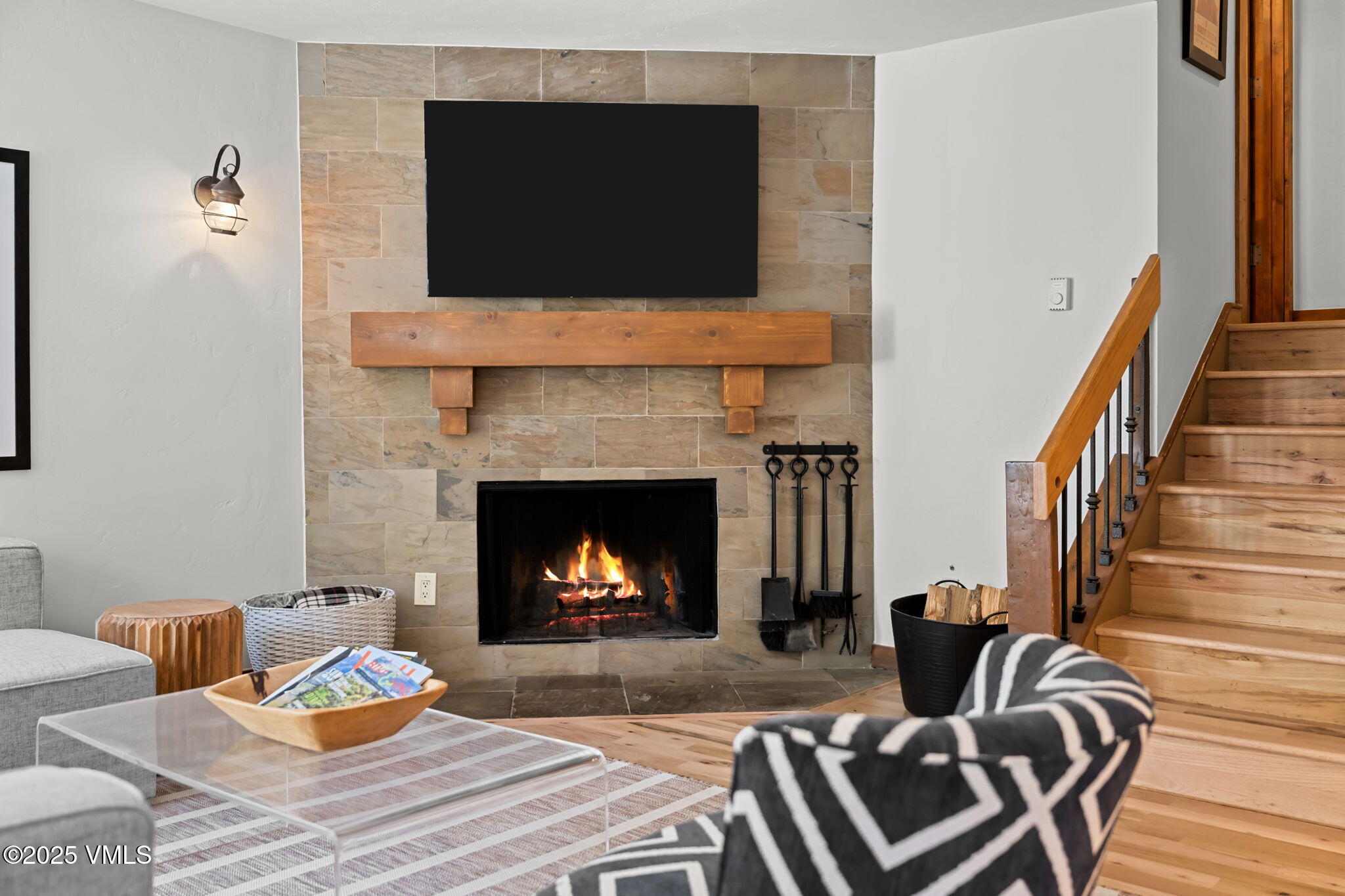 4770 Big Horn Road, Unit B4 Vail, CO 81657 - Photo 7 of 47 a living room with furniture a flat screen tv and a fireplace