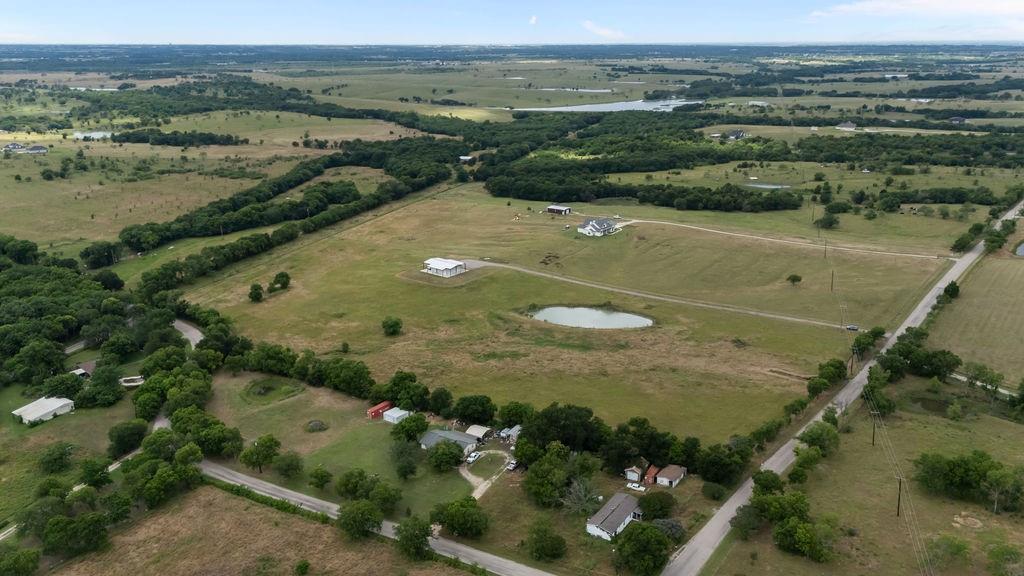 1161 Alsdorf Road Ennis, TX 75119 - Photo 3 of 28 Expansive rural property featuring multiple pastures, a large pond, and mature tree lines