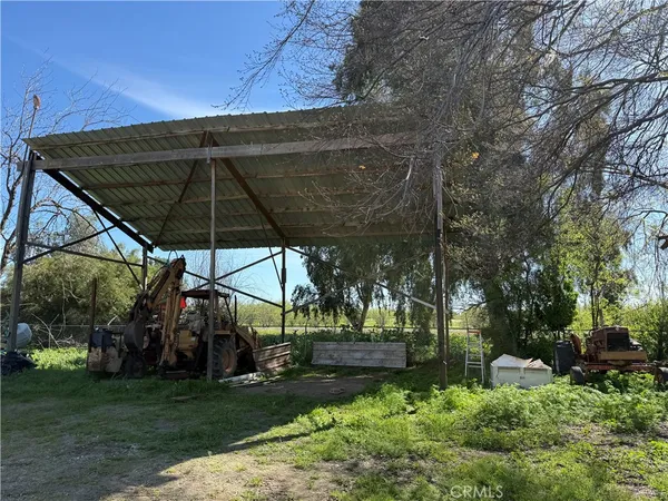 a view of a lawn chairs under an umbrella