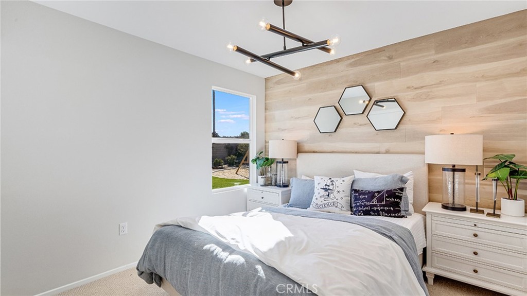 14193 Clemson Street Hesperia, CA 92344 - Photo 10 of 21 a bedroom with a bed and ceiling fan