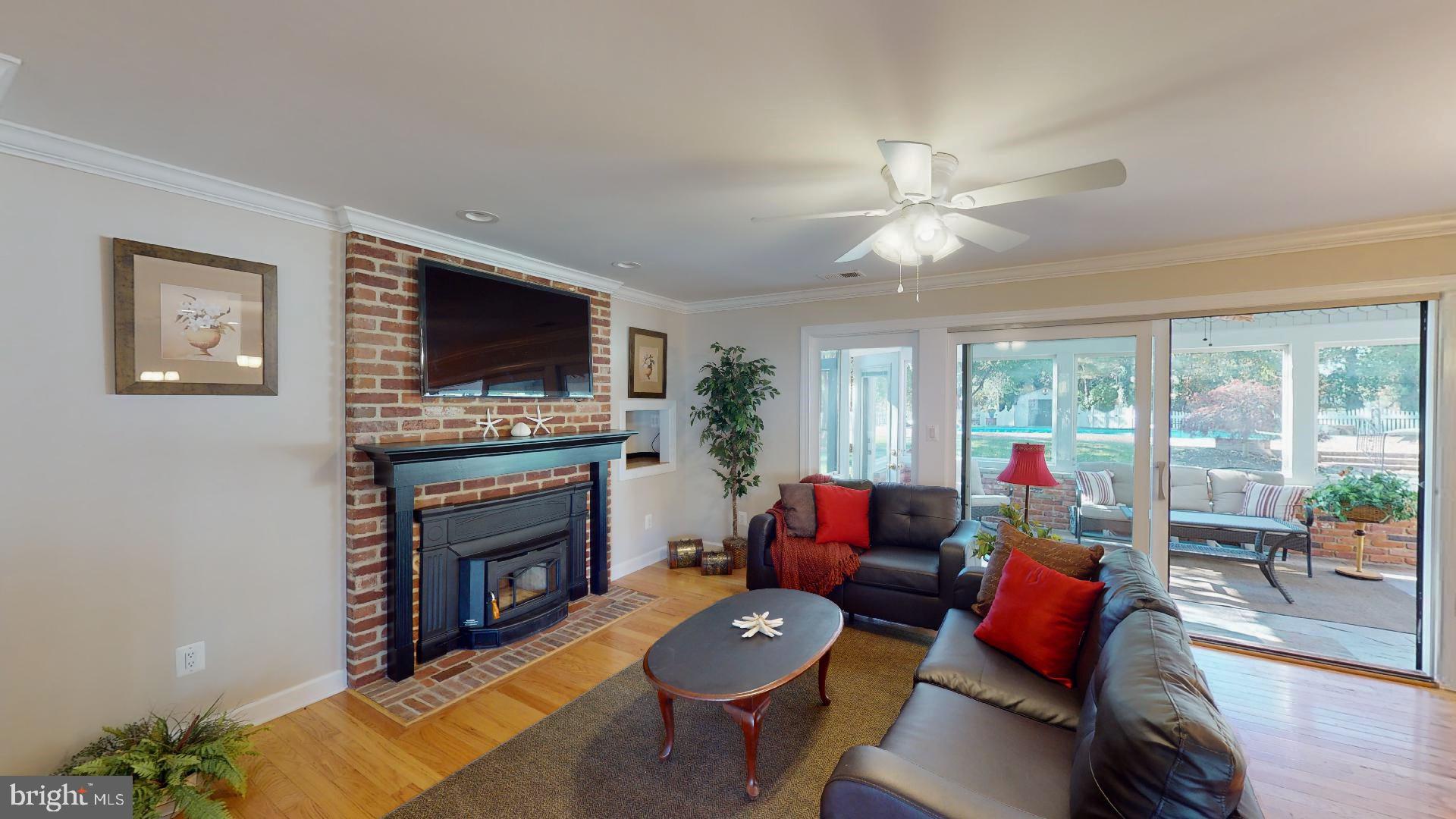 104 River Run Queenstown, MD 21658 - Photo 28 of 58 2nd fireplace w/woodstove insert