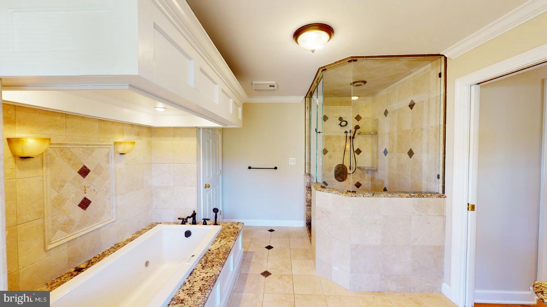 104 River Run Queenstown, MD 21658 - Photo 39 of 58 Amazing shower w/multiple heads & pebble floor.