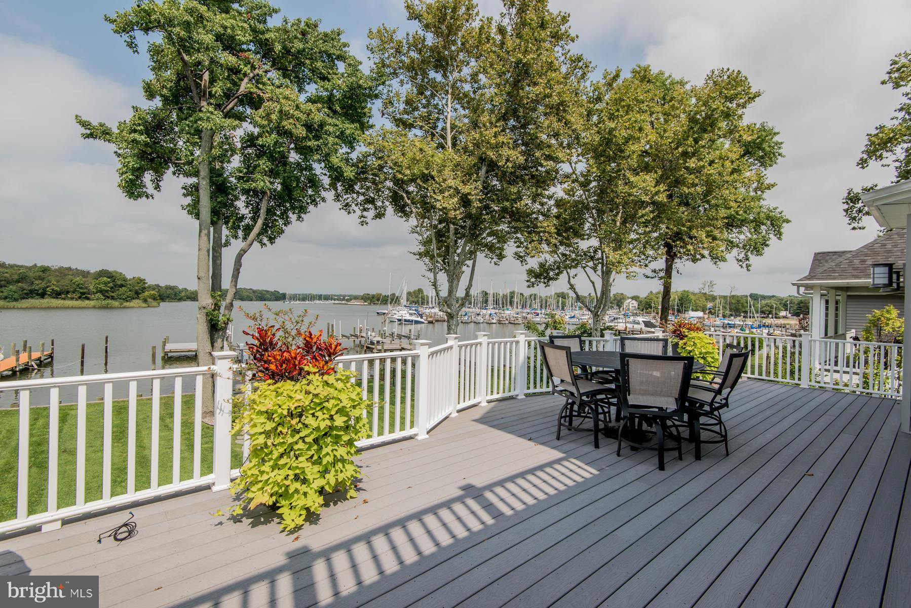 814 Frog Mortar Road Baltimore, MD 21220 - Photo 22 of 30 a view of a chairs and table on the wooden deck
