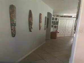 a view of a livingroom with furniture window and hardwood floor