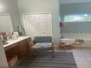 a bathroom with a sink toilet and a mirror