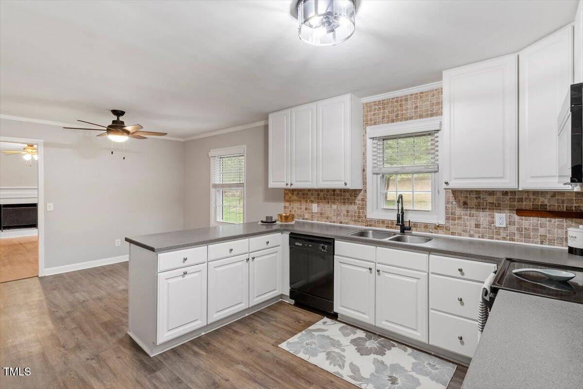 3402 Pat Tilley Road Bahama, NC 27503 - Photo 18 of 32 a kitchen with a sink cabinets and window