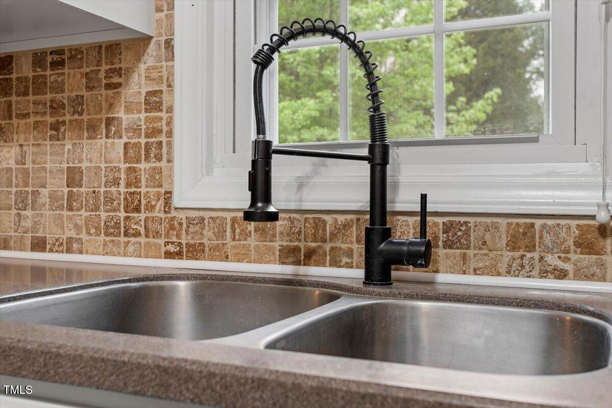 3402 Pat Tilley Road Bahama, NC 27503 - Photo 21 of 32 a view closed with a sink and bathtub