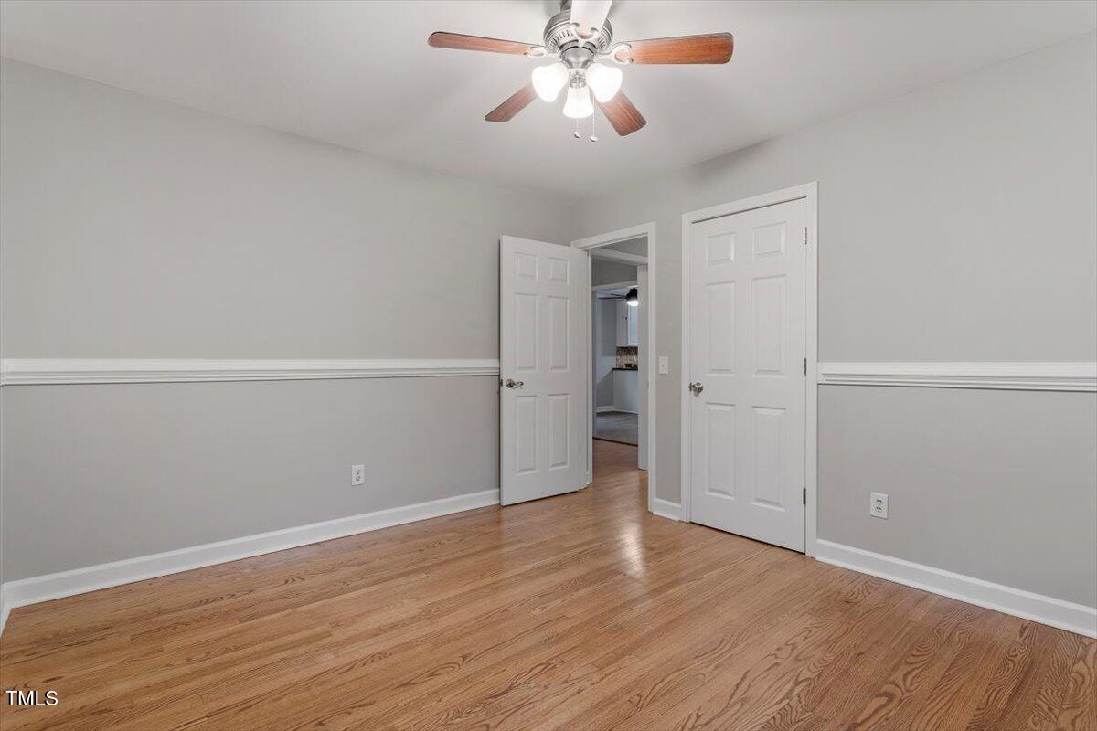 3402 Pat Tilley Road Bahama, NC 27503 - Photo 24 of 32 an empty room with wooden floor closet and windows