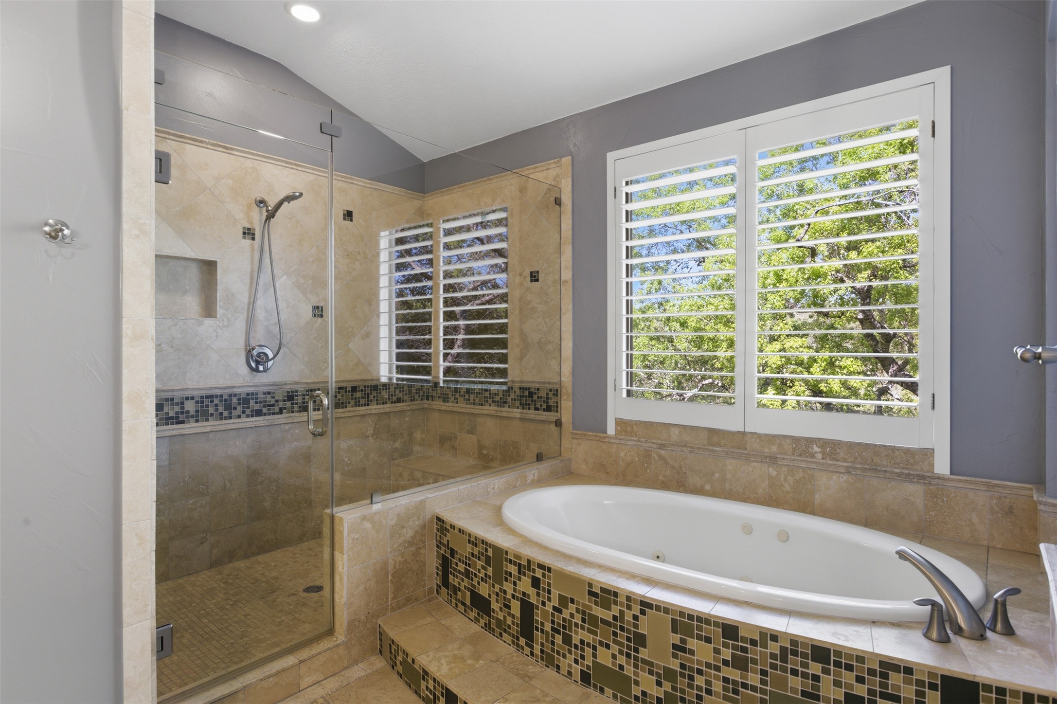 2008 Key West Cove Austin, TX 78746 - Photo 14 of 33 Full bathroom with a garden jet tub, vaulted ceiling, a large walk-in shower, and tile patterned flooring