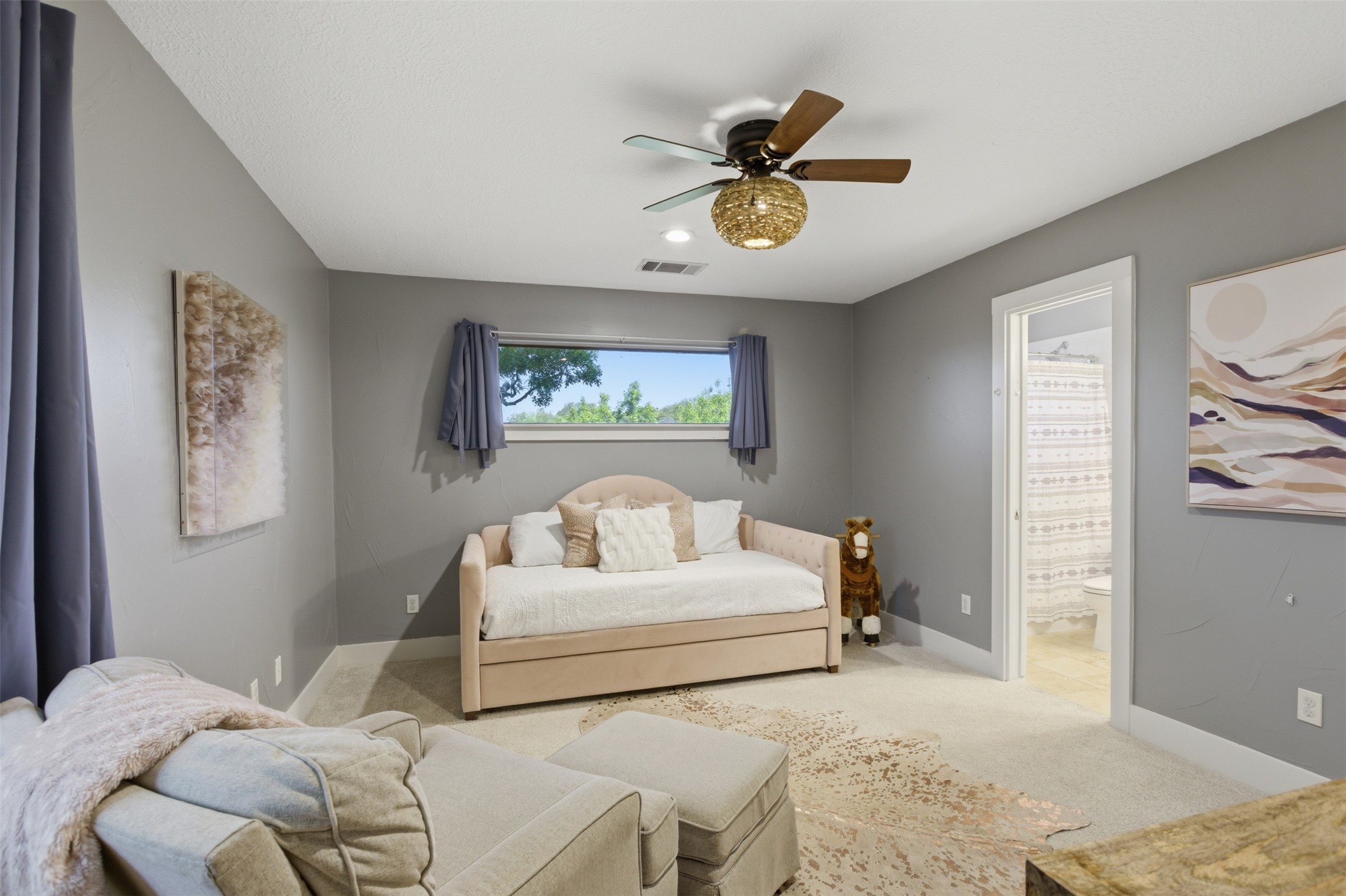 2008 Key West Cove Austin, TX 78746 - Photo 21 of 33 Carpeted bedroom featuring a ceiling fan and ensuite bathroom