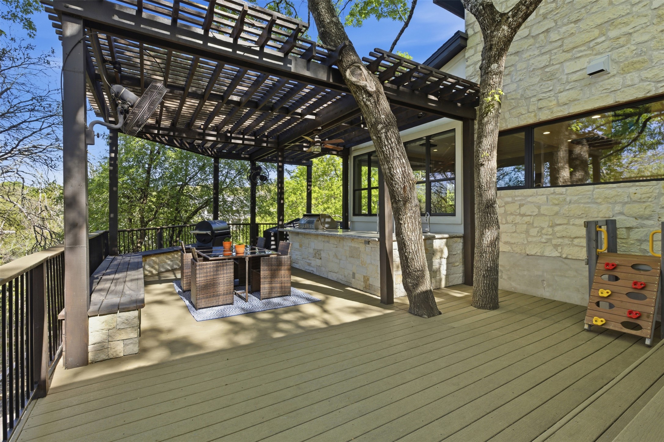 2008 Key West Cove Austin, TX 78746 - Photo 25 of 33 Composite deck with an outdoor kitchen with living area