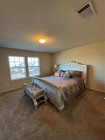 a room with a bed and a window