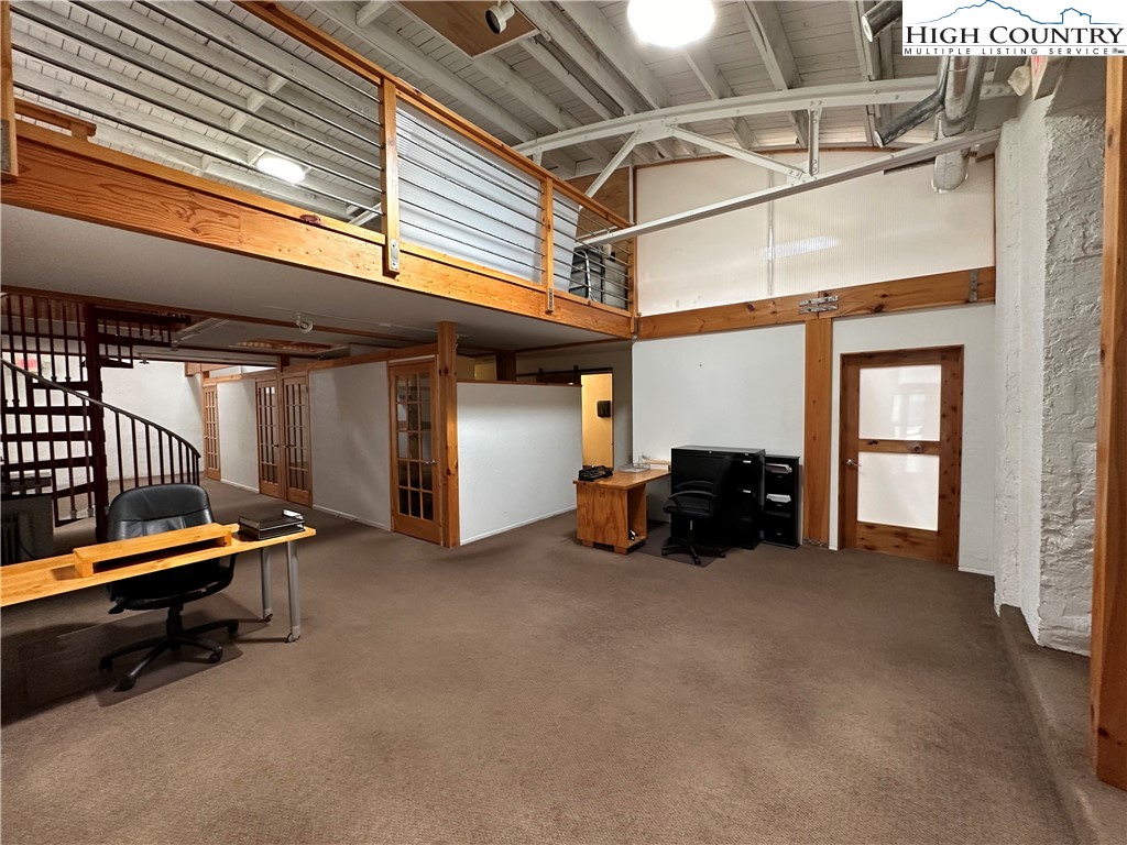 164 Depot Street Boone, NC 28607 - Photo 13 of 24 a view of a room with gym equipment and a large window