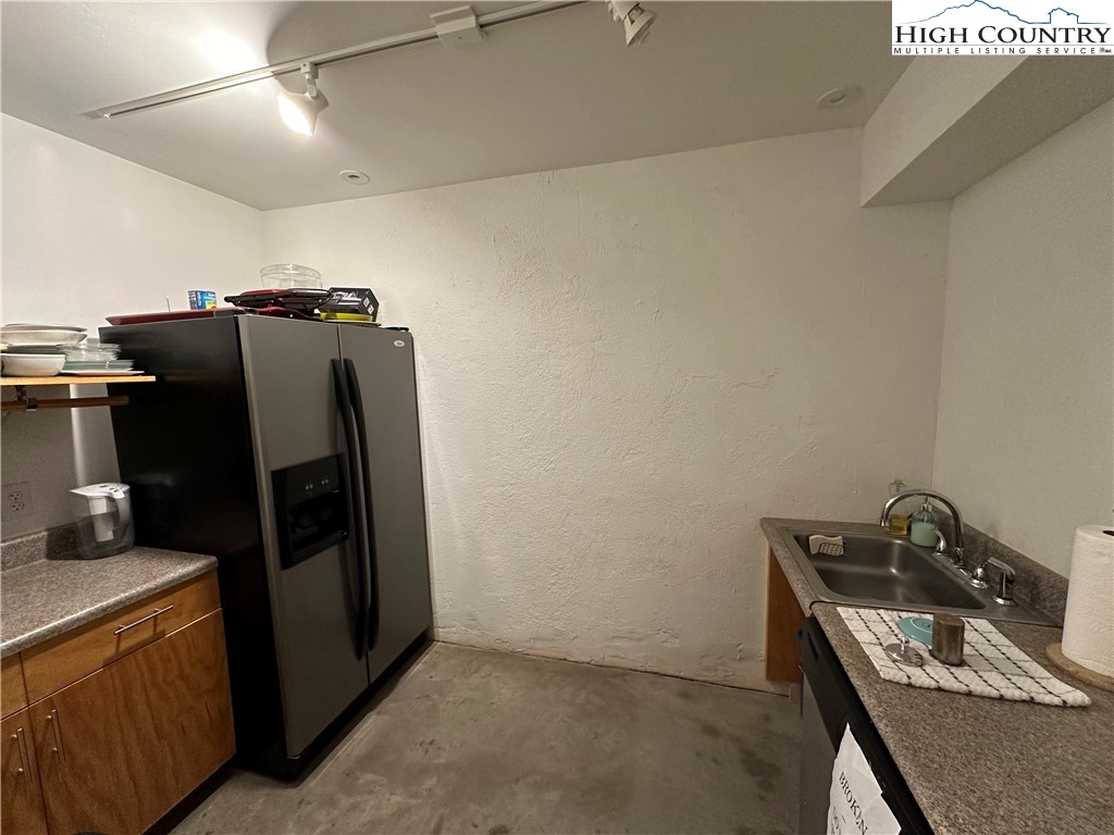164 Depot Street Boone, NC 28607 - Photo 23 of 24 a view of a storage and utility room with refrigerator and washer