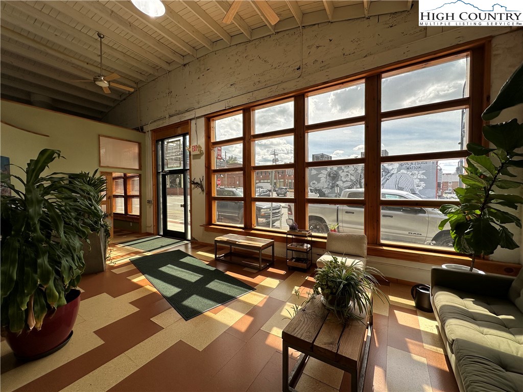 164 Depot Street Boone, NC 28607 - Photo 5 of 24 a view of a porch with furniture and a potted plant