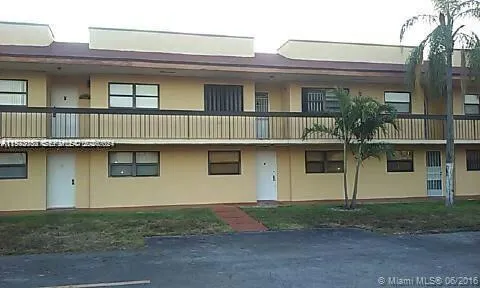 a view of a brick house with windows