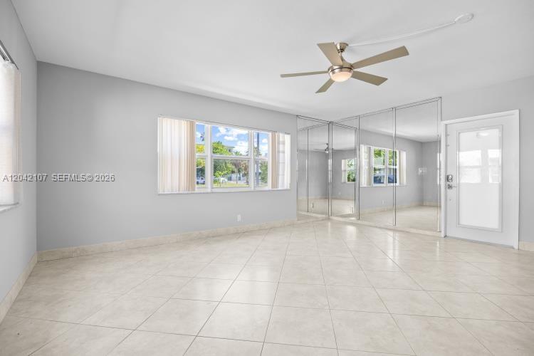 3213 Colony Club Road, Unit 3E Pompano Beach, FL 33062 - Photo 9 of 31 a view of an empty room with a window