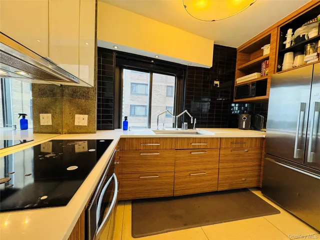 a view of swimming pool with a patio