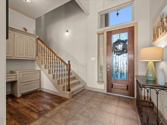a view of entryway and hall with furniture