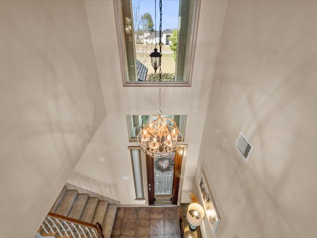 a living room with furniture and a ceiling fan