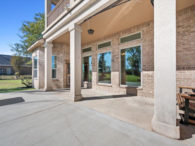a front view of a house with a yard and a garage