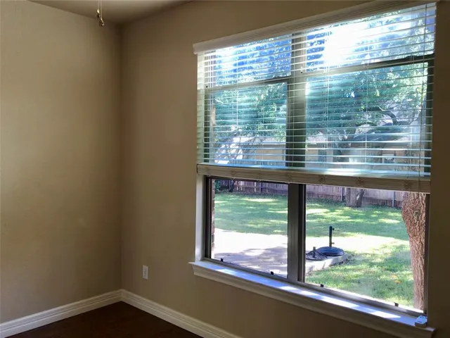 a view of a glass door with a roof deck
