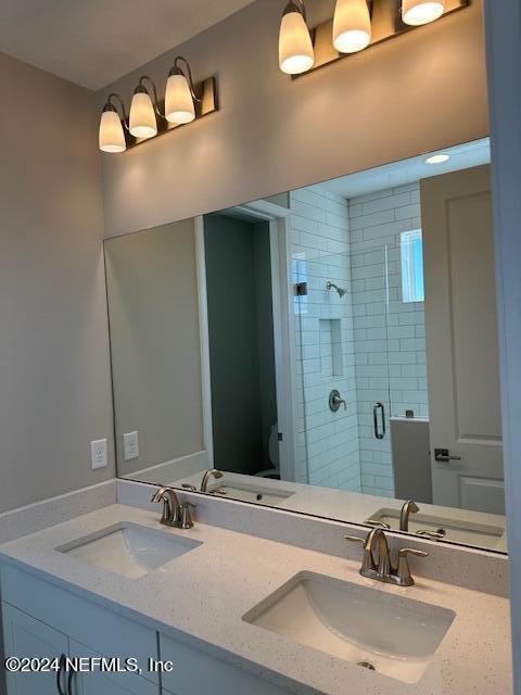 385 Rum Runner Way, Unit 49 St. Johns, FL 32259 - Photo 15 of 34 a bathroom with a sink and a mirror