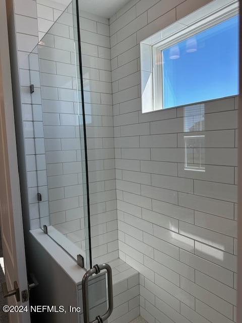 385 Rum Runner Way, Unit 49 St. Johns, FL 32259 - Photo 16 of 34 a bathroom with a shower