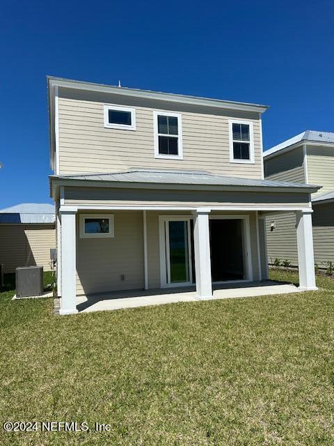 385 Rum Runner Way, Unit 49 St. Johns, FL 32259 - Photo 20 of 34 a front view of a house with yard