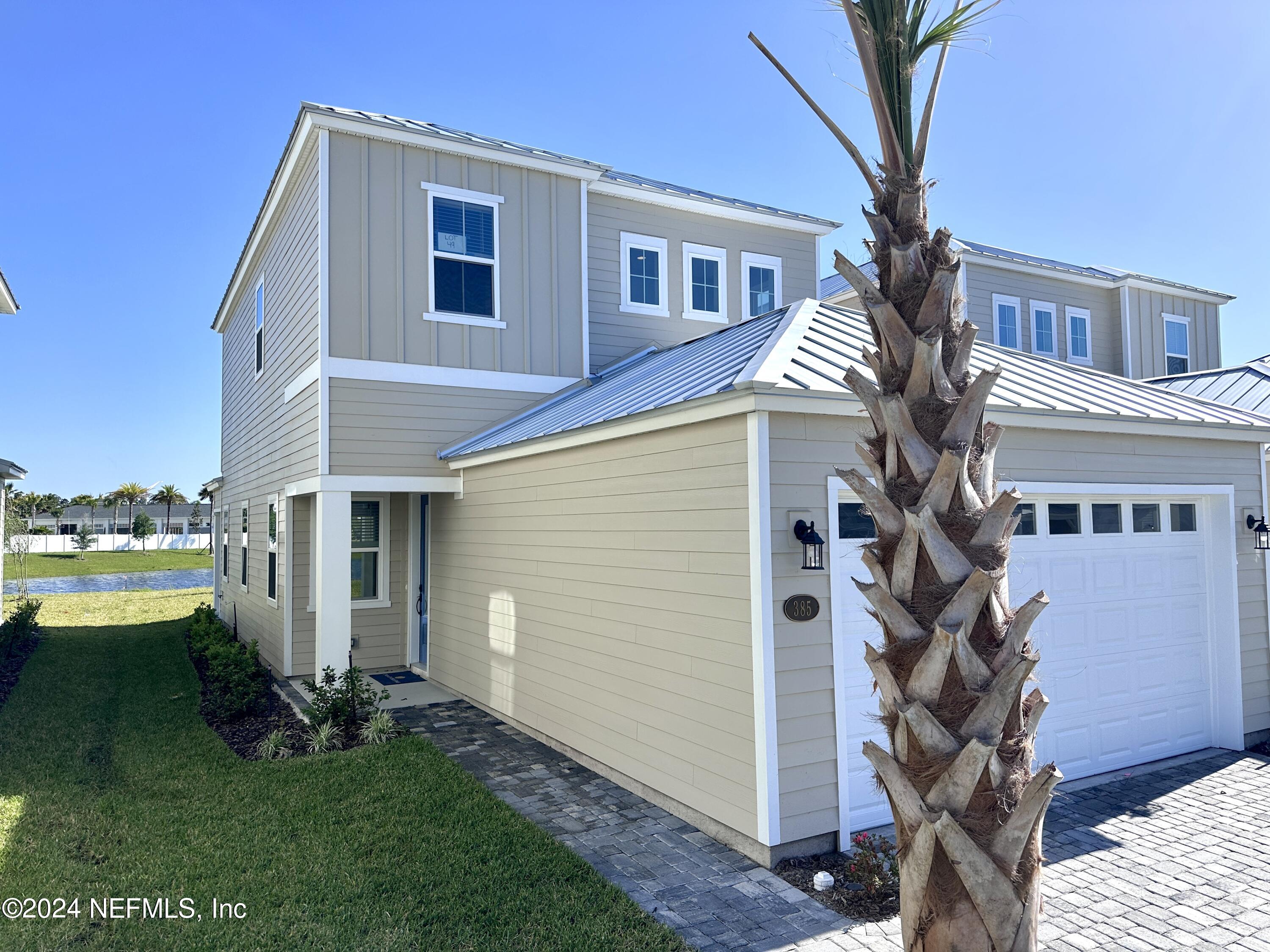 385 Rum Runner Way, Unit 49 St. Johns, FL 32259 - Photo 34 of 34 a view of a house with a yard