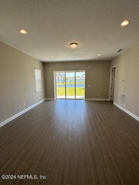 385 Rum Runner Way, Unit 49 St. Johns, FL 32259 - Photo 6 of 34 an empty room with wooden floor and a window
