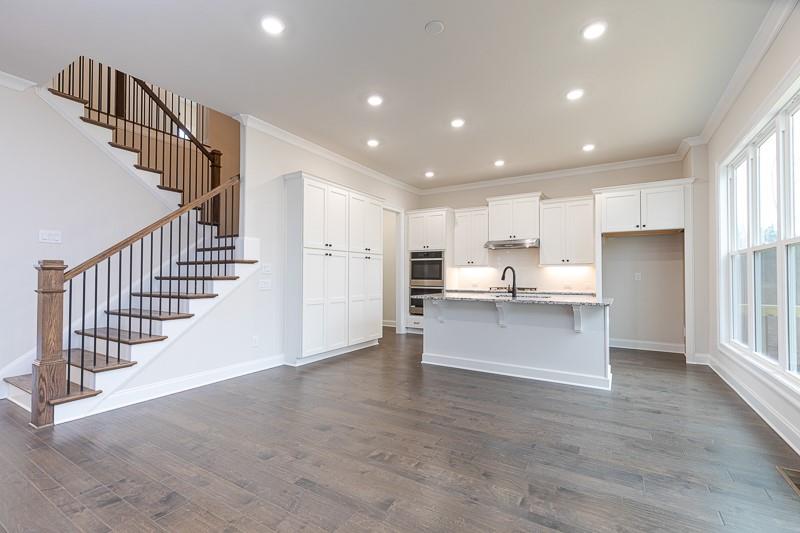 2411 Siskin Sq Road Duluth, GA 30096 - Photo 1 of 1 a view of kitchen with kitchen island wooden floors center island and center island