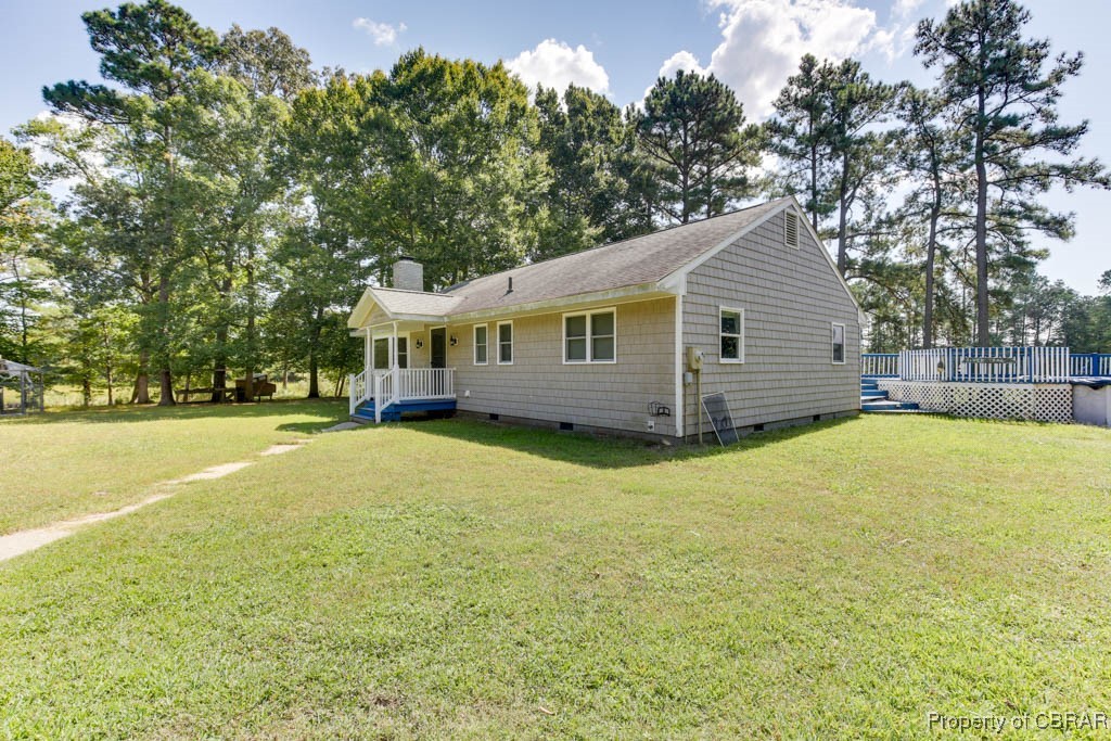 2584 Starvation Road Gloucester, VA 23061 - Photo 2 of 38 View of front facade featuring a front yard and a deck