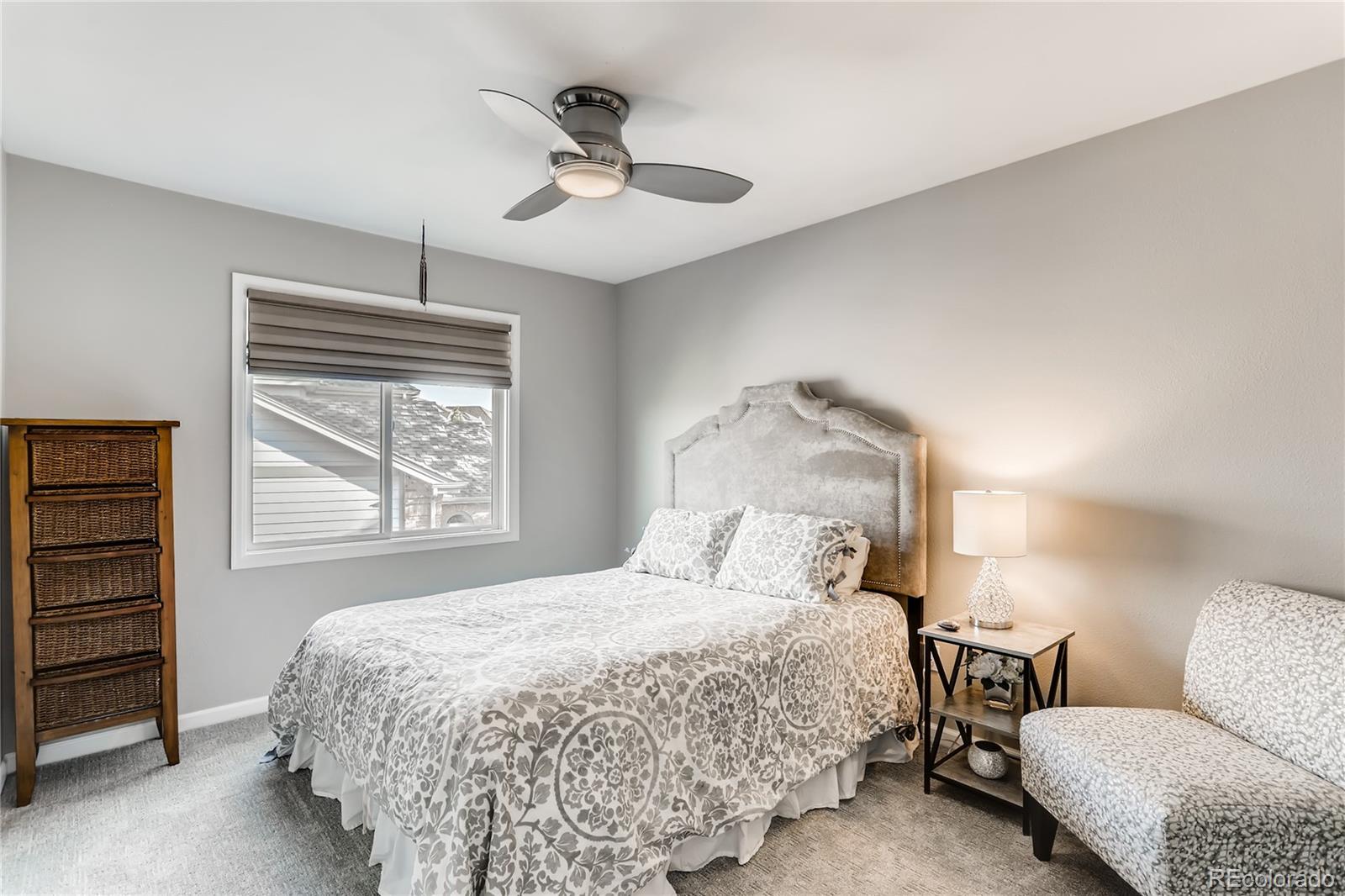 2883 East Ravenhill Circle Highlands Ranch, CO 80126 - Photo 14 of 25 a bedroom with bed and window