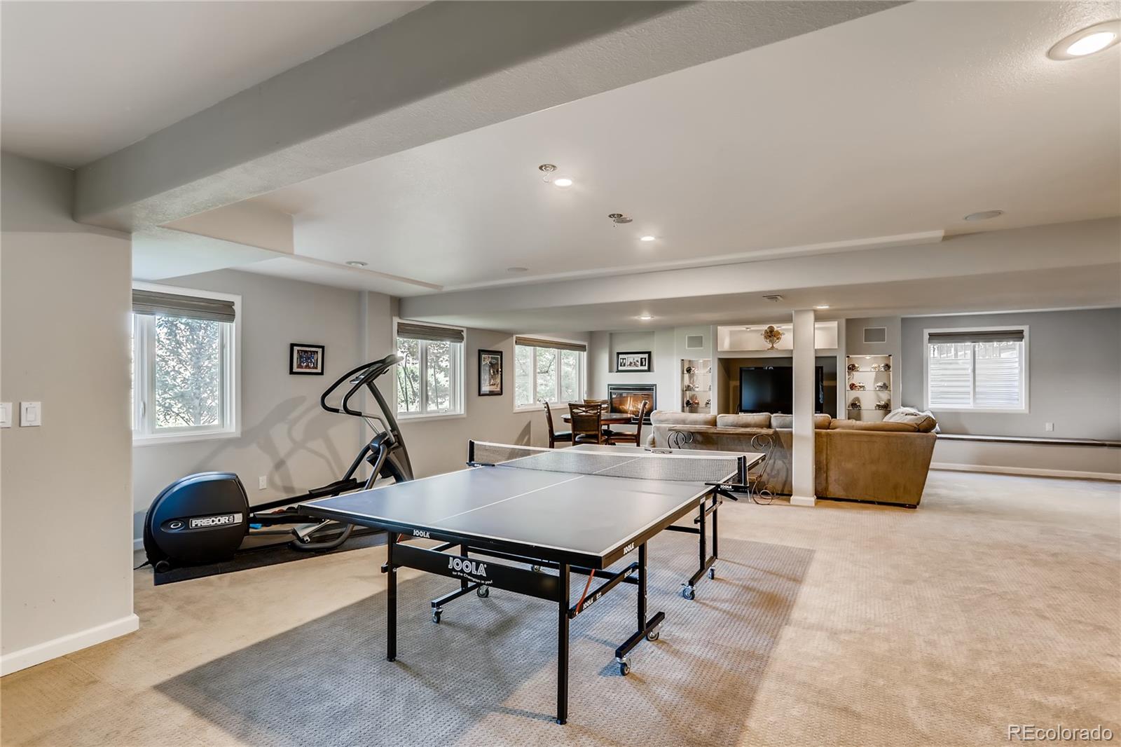 2883 East Ravenhill Circle Highlands Ranch, CO 80126 - Photo 18 of 25 a living room with furniture and a table