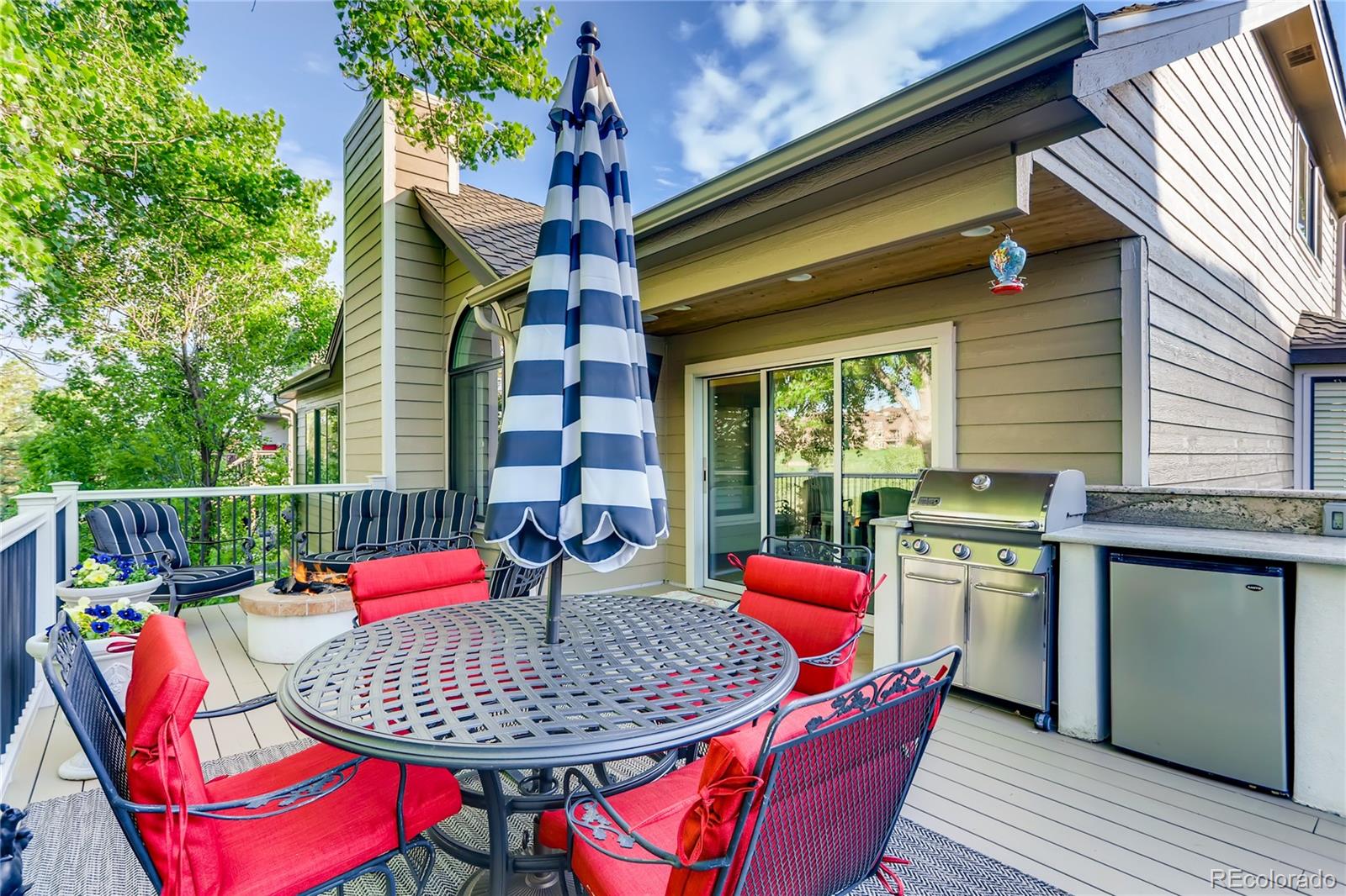 2883 East Ravenhill Circle Highlands Ranch, CO 80126 - Photo 20 of 25 an outdoor sitting area with furniture and wooden floor