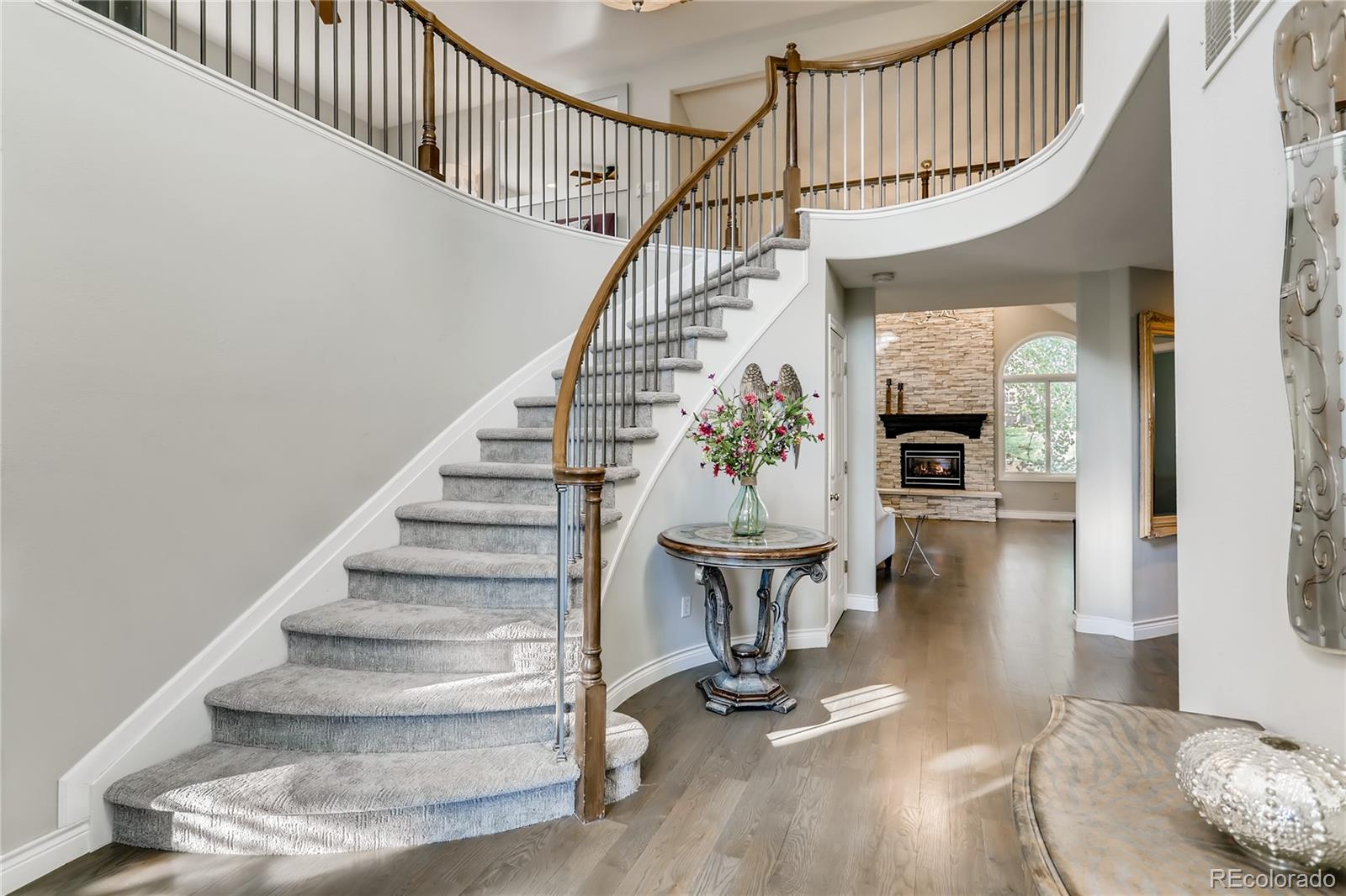 2883 East Ravenhill Circle Highlands Ranch, CO 80126 - Photo 2 of 25 a view of entryway and hall with wooden floor