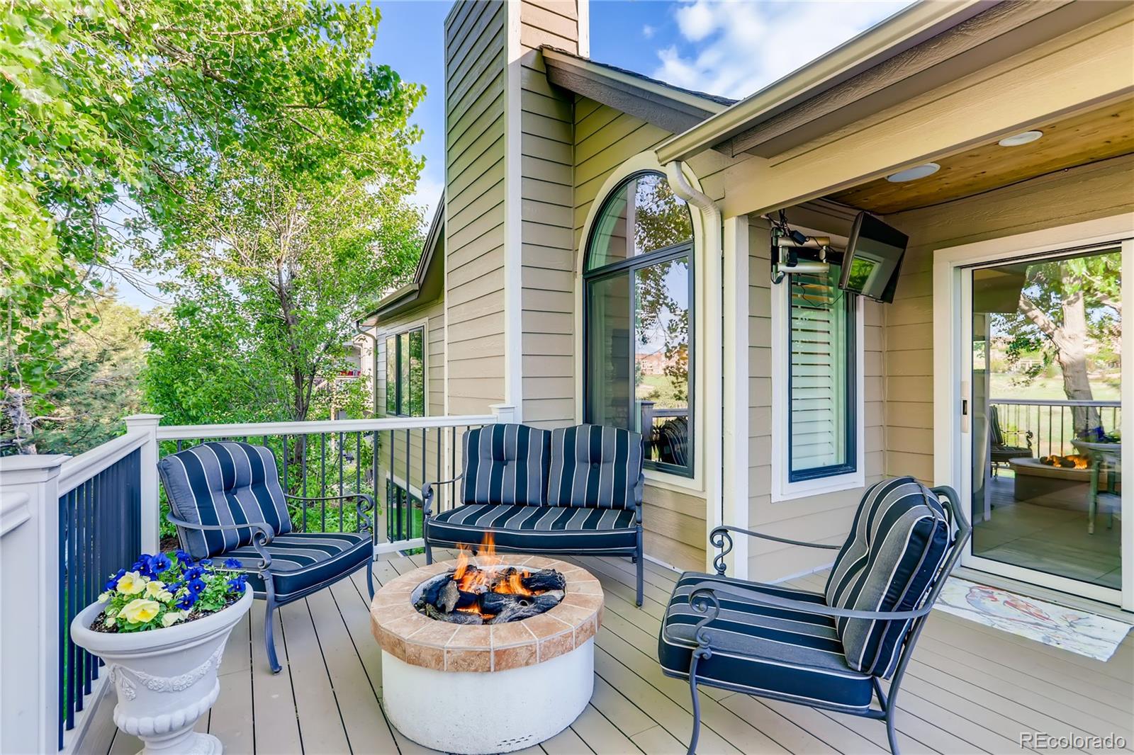 2883 East Ravenhill Circle Highlands Ranch, CO 80126 - Photo 21 of 25 a view of a patio filled with furniture and a potted plant