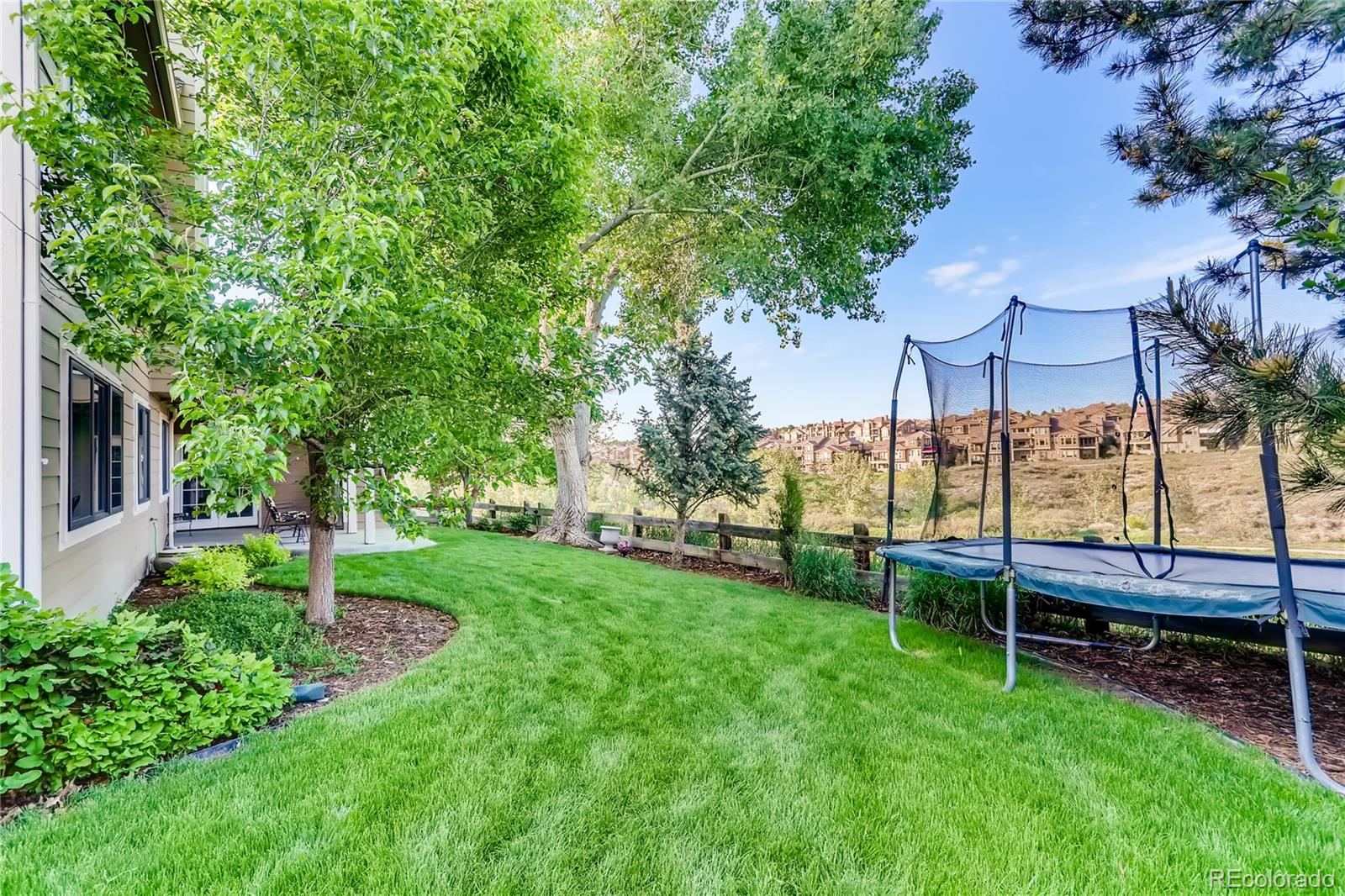2883 East Ravenhill Circle Highlands Ranch, CO 80126 - Photo 25 of 25 a view of yard with green space and seating area