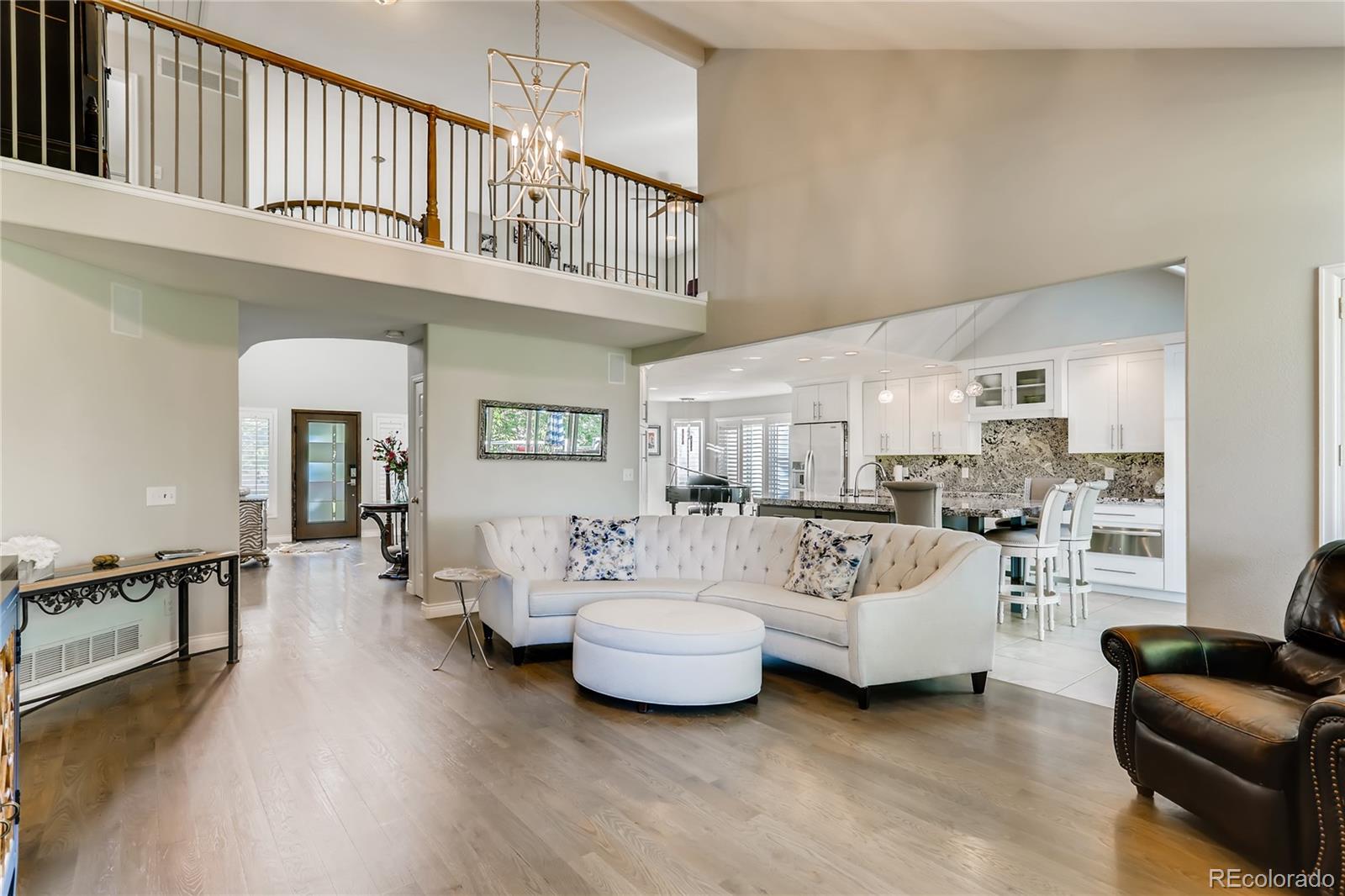 2883 East Ravenhill Circle Highlands Ranch, CO 80126 - Photo 4 of 25 a living room with furniture and a large window