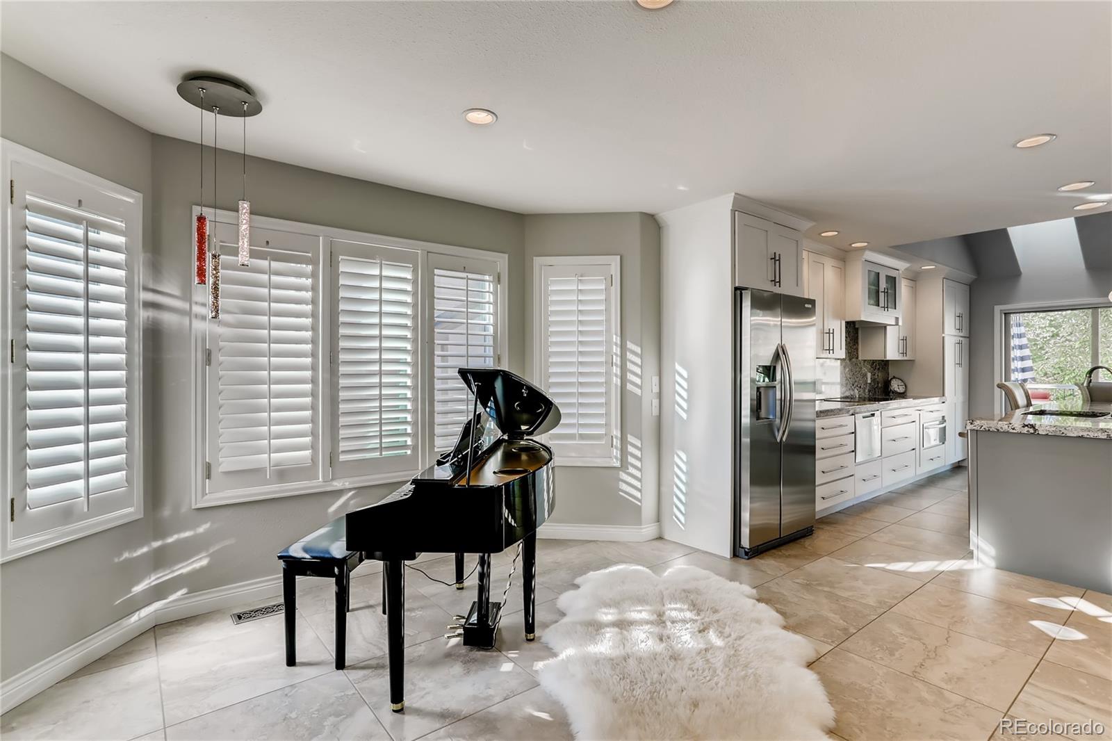 2883 East Ravenhill Circle Highlands Ranch, CO 80126 - Photo 8 of 25 a living room with furniture and a window