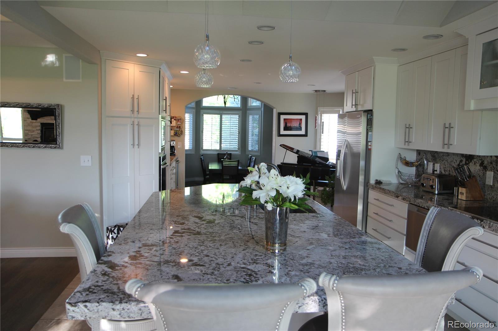 2883 East Ravenhill Circle Highlands Ranch, CO 80126 - Photo 9 of 25 a lobby with furniture and potted plant