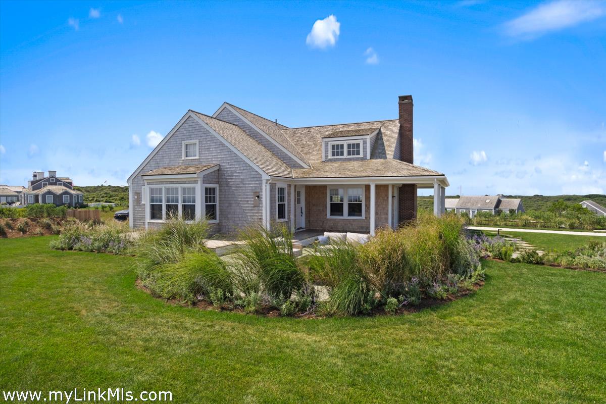 37 Sankaty Head Road Nantucket, MA 02554 - Photo 52 of 65 a front view of a house with a garden